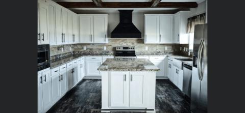 The Modern Kitchen of the Bryant Cavalier Home Builders Manufactured Home from Worldwide Homes in Lumberton, Texas